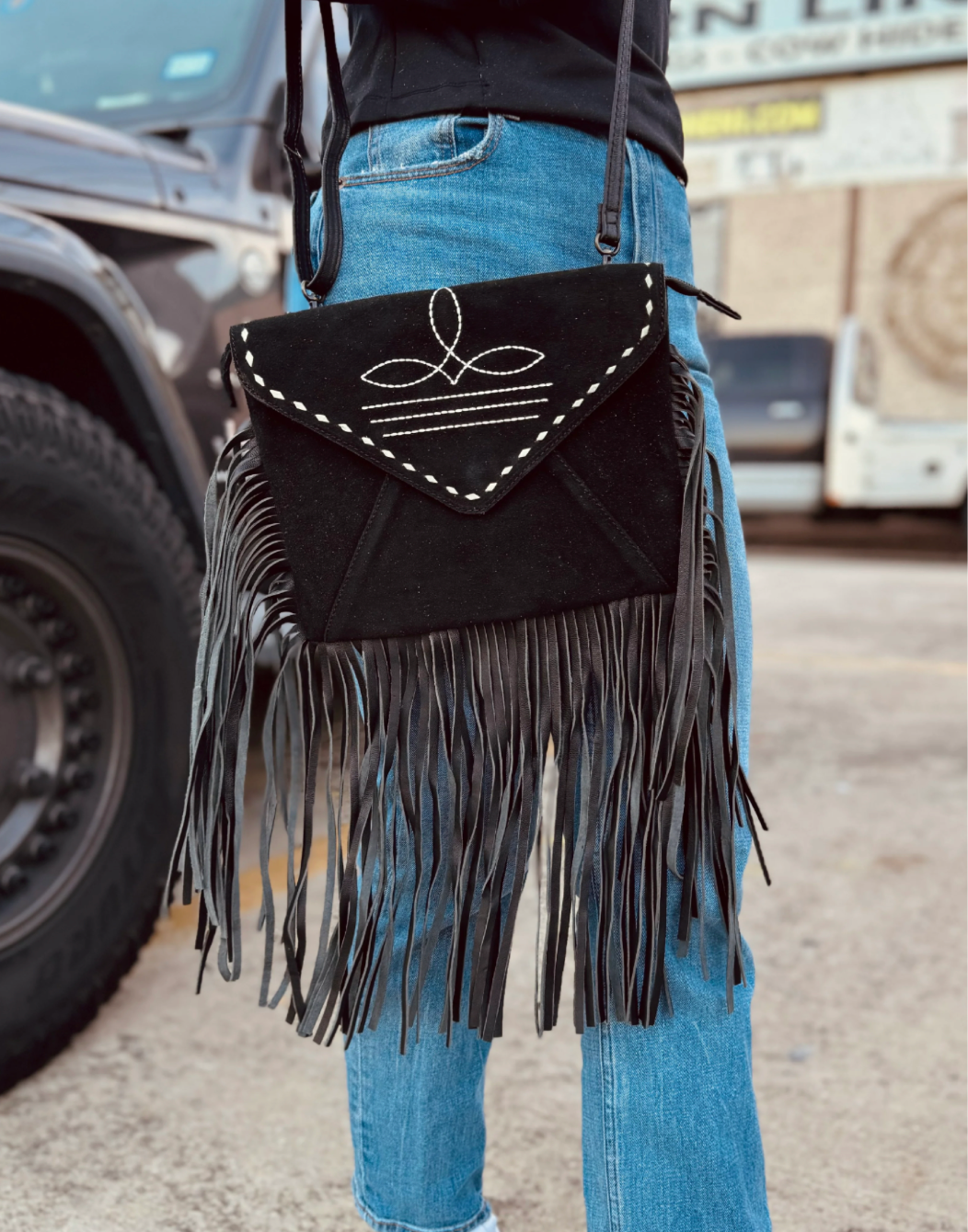 BLACK SUEDE LEATHER BOOTSTITCH FRINGE CROSSBODY